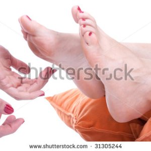 stock photo tickling women feet and laughing hard studio shot 31305244