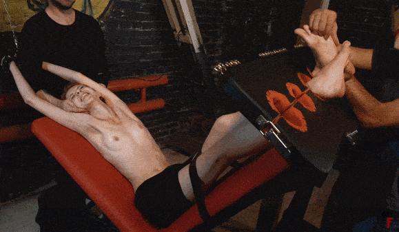 Topless_Fashion_Model_gets_tickled_in_stocks_by_two_ticklers_fhd.gif
