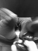 mary_s_feet_tickled_in_fishnets_in_b_w_02_by_osco89-d7flsrl.jpg