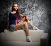 stock-photo-35618886-portrait-of-young-girl-on-sofa.jpg