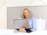 25545614-business-technology-internet-and-hotel-concept-happy-businesswoman-with-laptop-computer.jpg