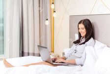 25545989-business-technology-internet-and-hotel-concept-happy-businesswoman-with-laptop-computer.jpg