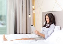 25545992-business-technology-internet-and-hotel-concept-happy-businesswoman-with-tablet-pc-compu.jpg