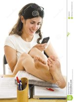 barefoot-girl-looking-smartphone-32363130.jpg