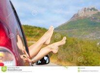 female-feet-stick-out-car-window-bare-mountain-background-travel-concept-39162929.jpg