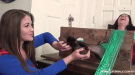 SupergirlVsWonderwomanphosefoottickle1.gif