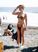 Sexy-Photo-of-Carrie-Fisher-in-Slave-Leia-Metal-Bikini-on-the-Beach-700x944.jpg