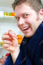 17748659-Handsome-man-going-to-eat-ham-near-open-fridge-Stock-Photo.jpg