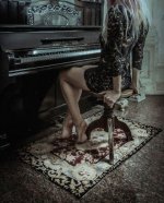Evi plays piano.jpg