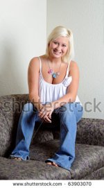 stock-photo-young-blonde-woman-sitting-on-couch-in-white-tank-and-blue-jeans-smiling-63903070.jpg