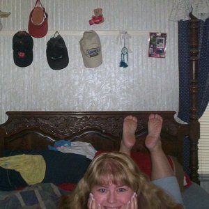 just chillin on the bed with my ticklish feet showing hehe