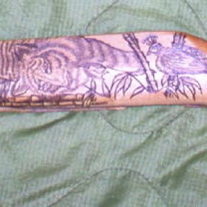 Left Side - Chinese SKS - Full Side Shot

On this SKS, the man who commissioned me to do it said to load it up with Chinese art, symbols and animals a