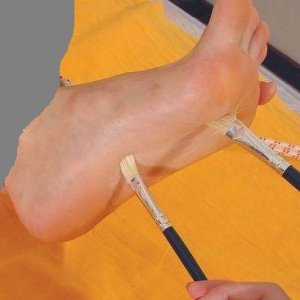 foottickling with brushes