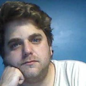 Few months ago sitting in my roommate's bedroom.  I was going for the 'Thinker' look.  I was hoping to have a dreamy expression but it looks like I'm 