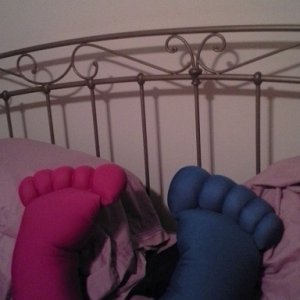 Sign on wall reads "WARNING: Feet make me horny"