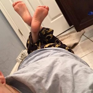 Nips showing off her oh so ticklish and soft soles.