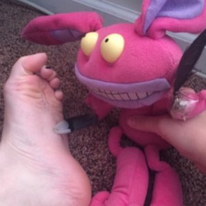 Ickis tickling my left foot with a feather!