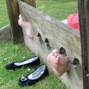 Shoes have been removed, feet wide apart!