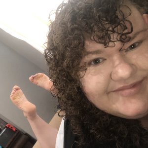 Just a late 20 something with curly hair and ticklish feet (and everywhere else).