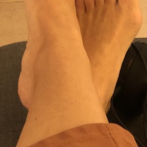 Relaxing while she waits for me to get home. Nothing better to come home to than her asking me to rub her feet.