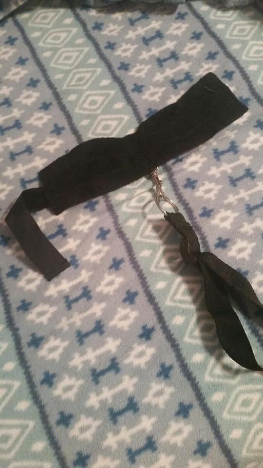 Leather cuffs; part of an under-the-bed restraint system.