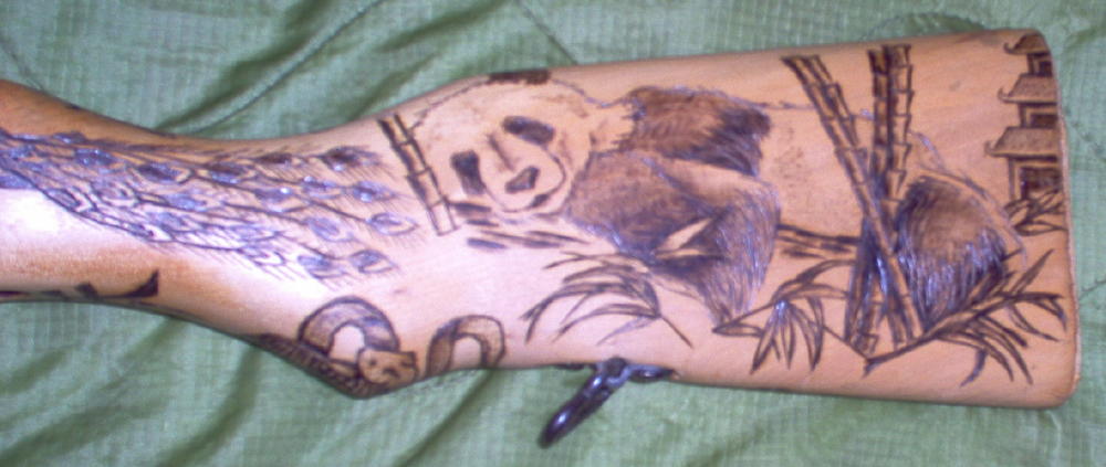 Left Side - Chinese SKS - Panda and Bamboo

On this SKS, the man who commissioned me to do it said to load it up with Chinese art, symbols and animals