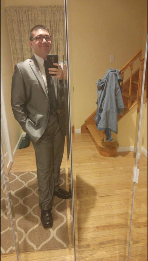 Me in a suit. Please excuse the mess in the background. I took the picture by the entrance closet. I was about to leave for work.