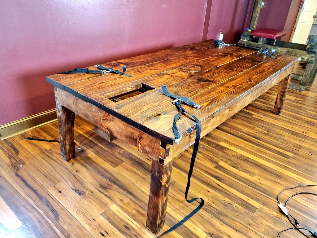 New wooden bondage table.
