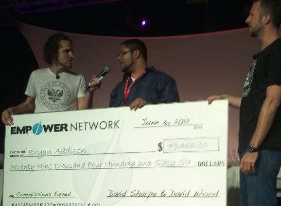 On stage at a work convention recieving a check